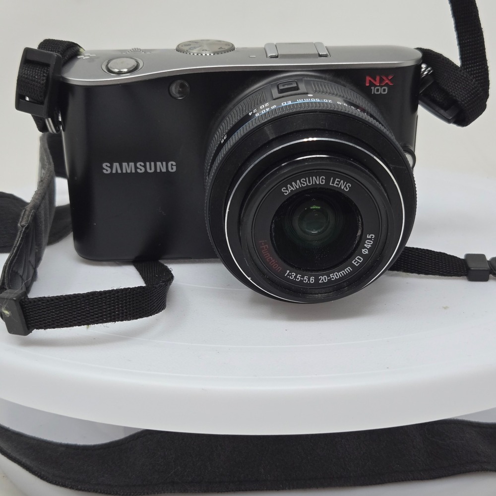 Samsung NX100 Mirrorless Digital Camera Black with 20-50mm Lens and Charger